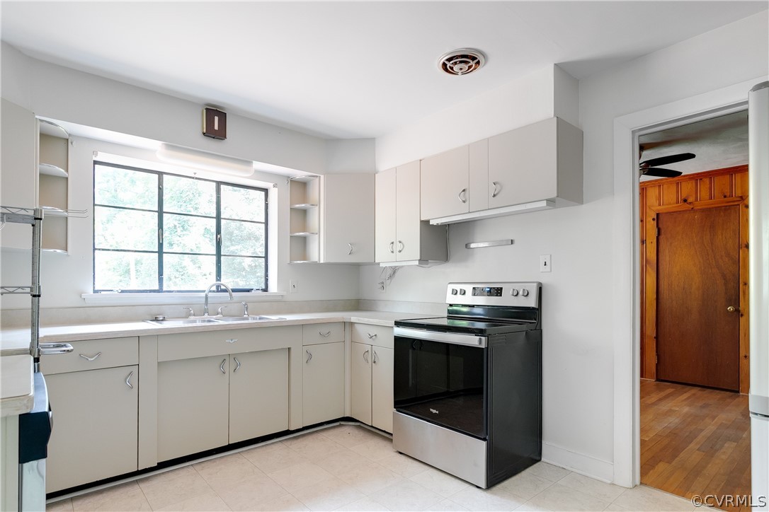 3911 Arklow Road Richmond, VA 23235 - Photo 15 of 39 a kitchen with stainless steel appliances granite countertop white cabinets and a sink