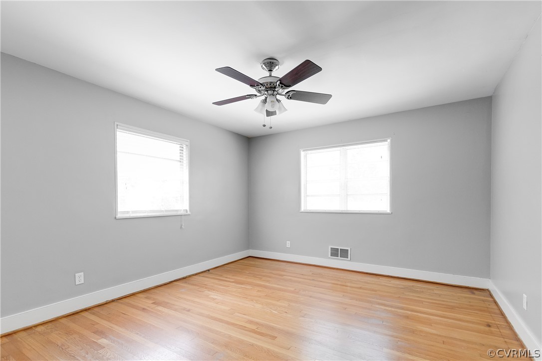 3911 Arklow Road Richmond, VA 23235 - Photo 18 of 39 an empty room with a window and a ceiling fan
