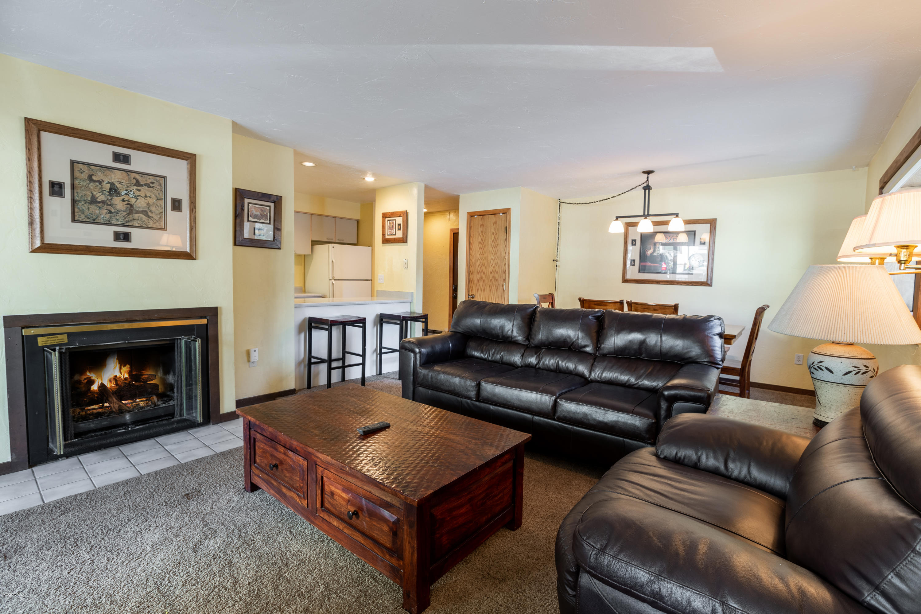 963 Lions Ridge Loop, Unit 501 Vail, CO 81657 - Photo 2 of 9 a living room with furniture and a fireplace