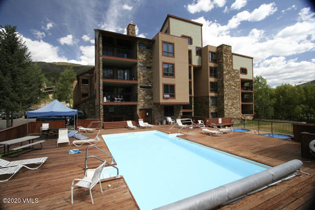 963 Lions Ridge Loop, Unit 501 Vail, CO 81657 - Photo 9 of 9 a view of a patio with a table and chairs