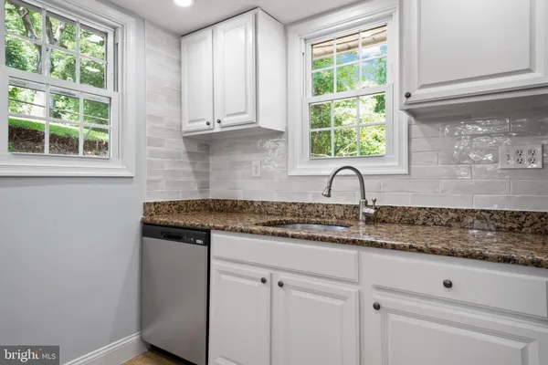 a bathroom with a sink toilet and vanity