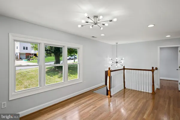 a view of an entryway with wooden floor