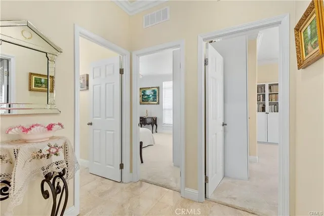 a view of a livingroom with bathroom and front door