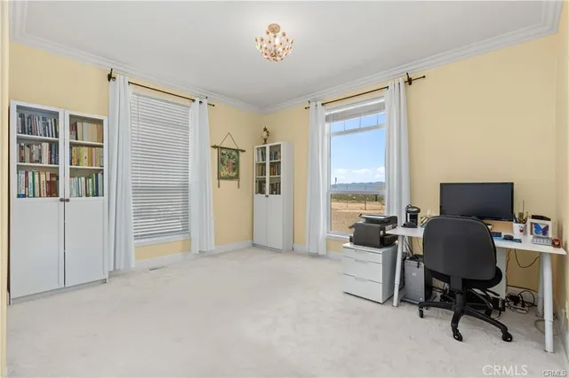 a workspace with furniture and a window