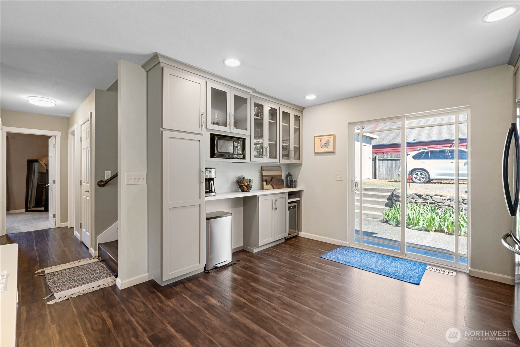 1211 Maybelle Street Sumner, WA 98390 - Photo 11 of 38 a kitchen with stainless steel appliances a refrigerator and wooden floor