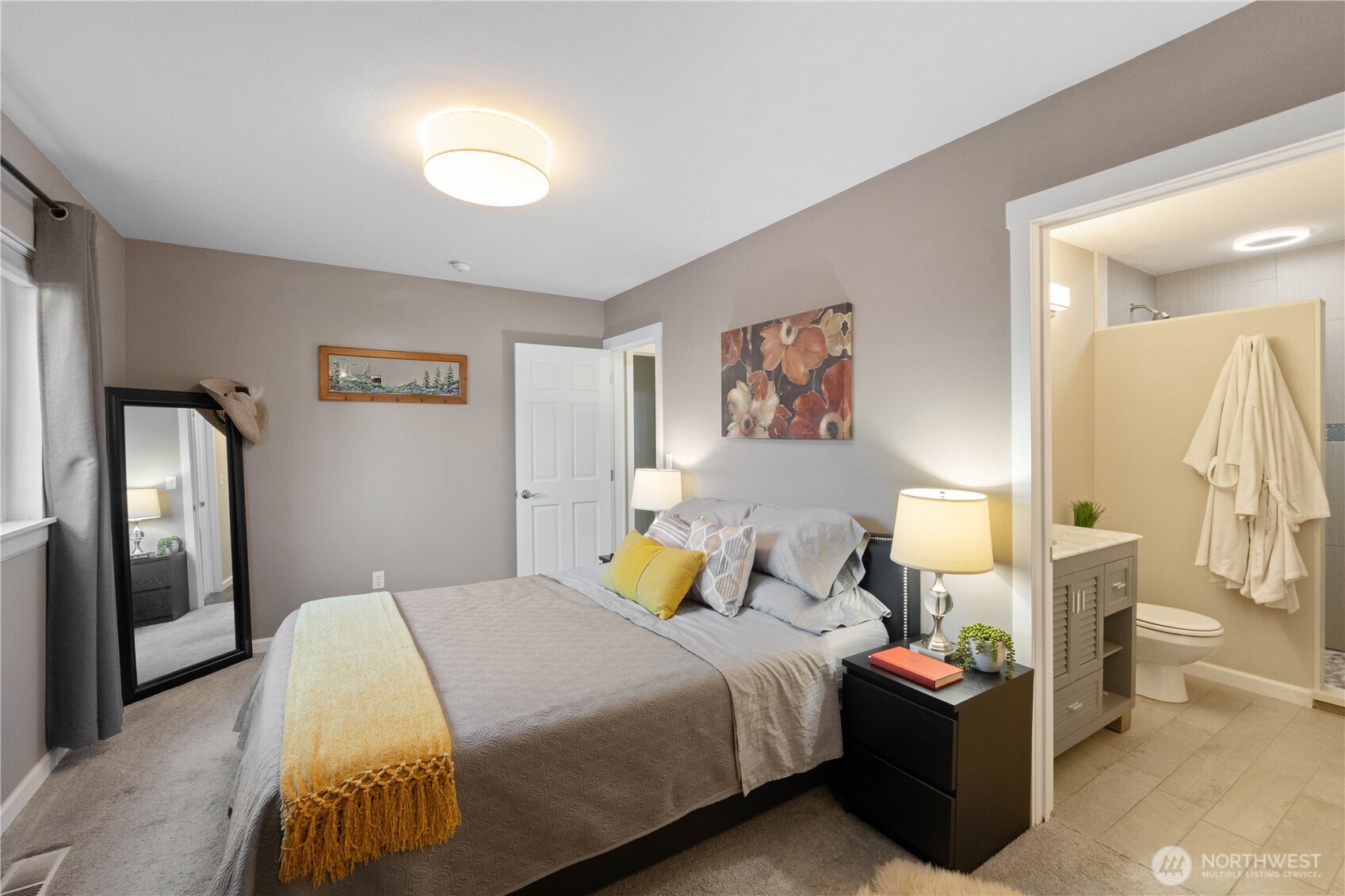 1211 Maybelle Street Sumner, WA 98390 - Photo 13 of 38 a bedroom with a bed and lamp