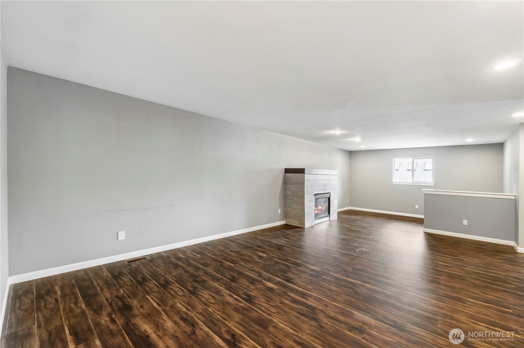 1211 Maybelle Street Sumner, WA 98390 - Photo 22 of 38 a view of empty room with wooden floor