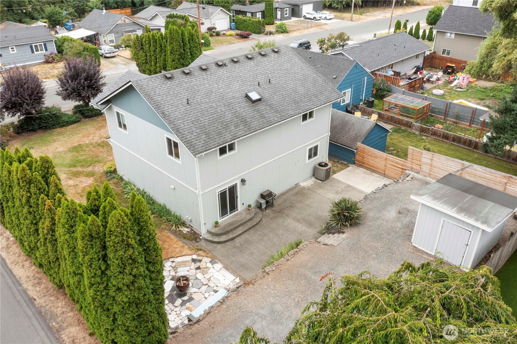 1211 Maybelle Street Sumner, WA 98390 - Photo 30 of 38 an aerial view of a house with a yard