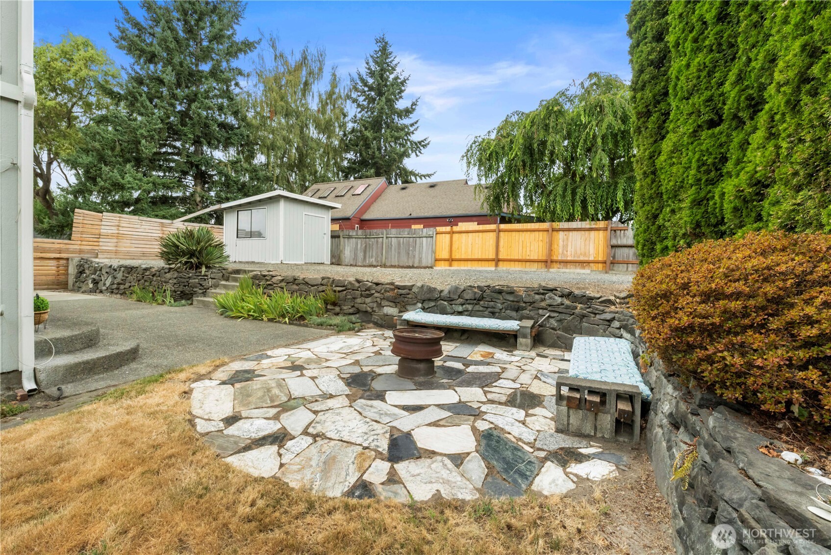 1211 Maybelle Street Sumner, WA 98390 - Photo 33 of 38 a view of a backyard with a garden and plants