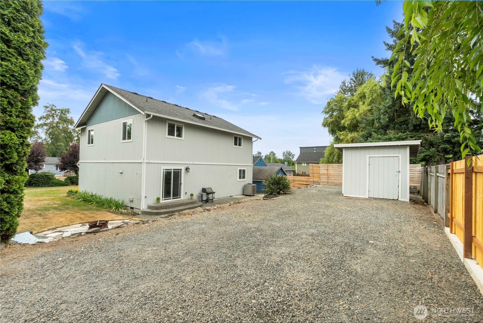 1211 Maybelle Street Sumner, WA 98390 - Photo 34 of 38 a view of a house with backyard and trees