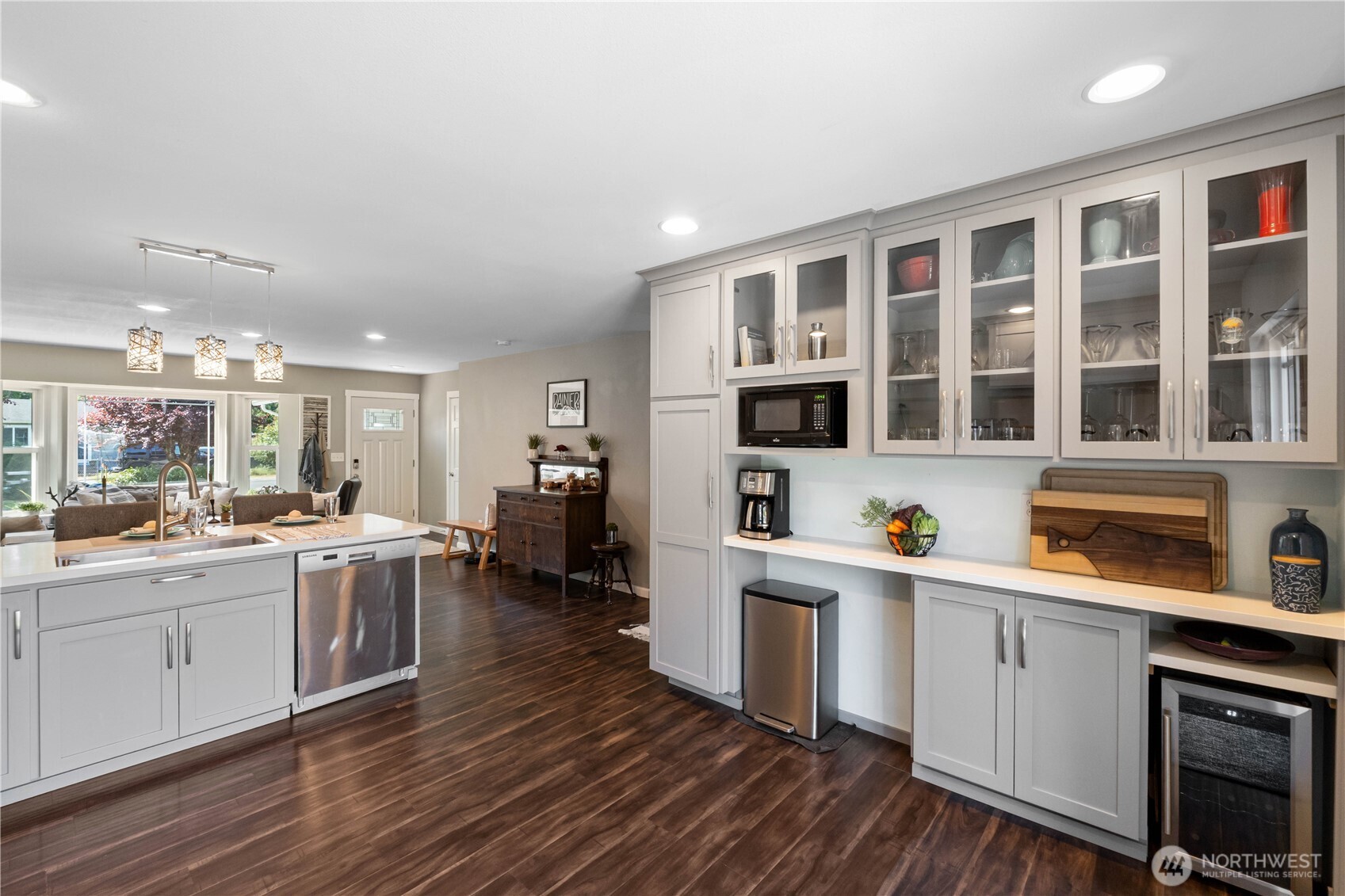 1211 Maybelle Street Sumner, WA 98390 - Photo 10 of 38 a kitchen with a sink cabinets and wooden floor