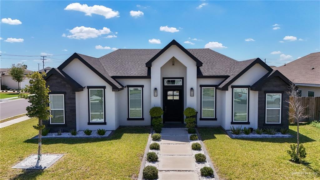 3304 East Rabbit Run Avenue Alton, TX 78573 - Photo 1 of 1 a front view of a house with garden