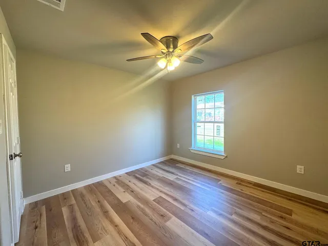 wooden floor and window in an empty room
