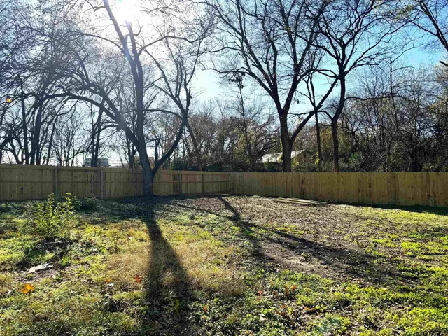 a view of backyard with green space