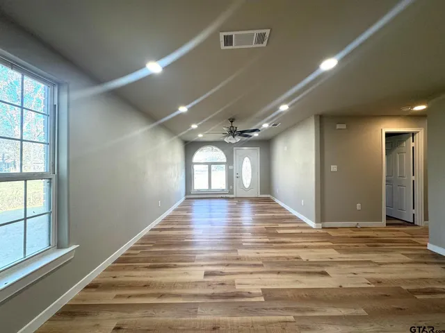 a view of an empty room and window