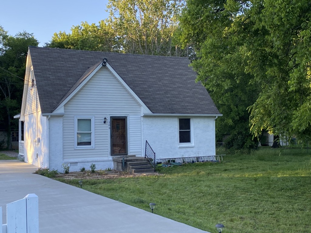front view of a house with a yard