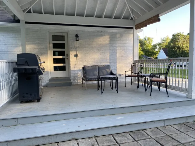 a dining room with furniture and a window