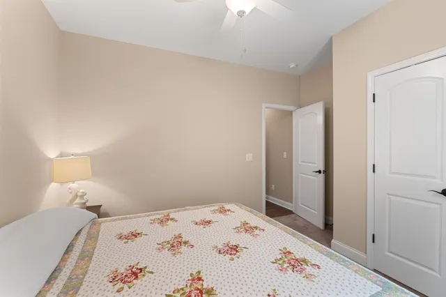 a bedroom with a bed and a dresser in it