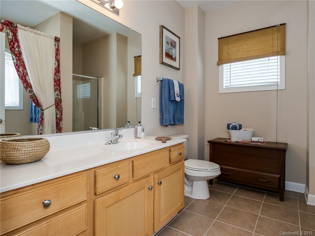 4160 Walker Road Charlotte, NC 28211 - Photo 12 of 13 a bathroom with a toilet sink and mirror