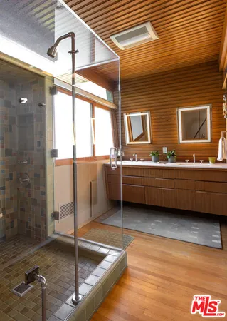 a bathroom with a tub and a shower