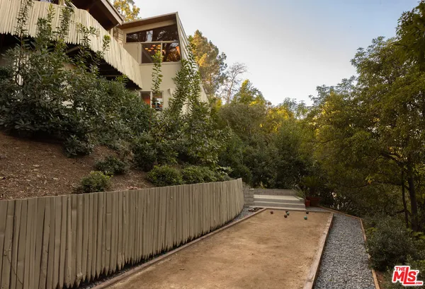 a view of a balcony with wooden fence and floor