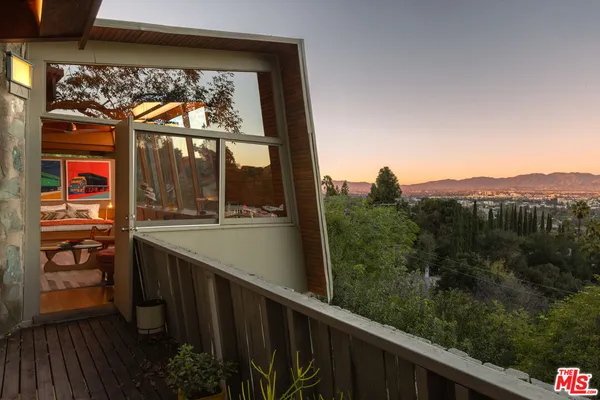 a view of a balcony with an outdoor space