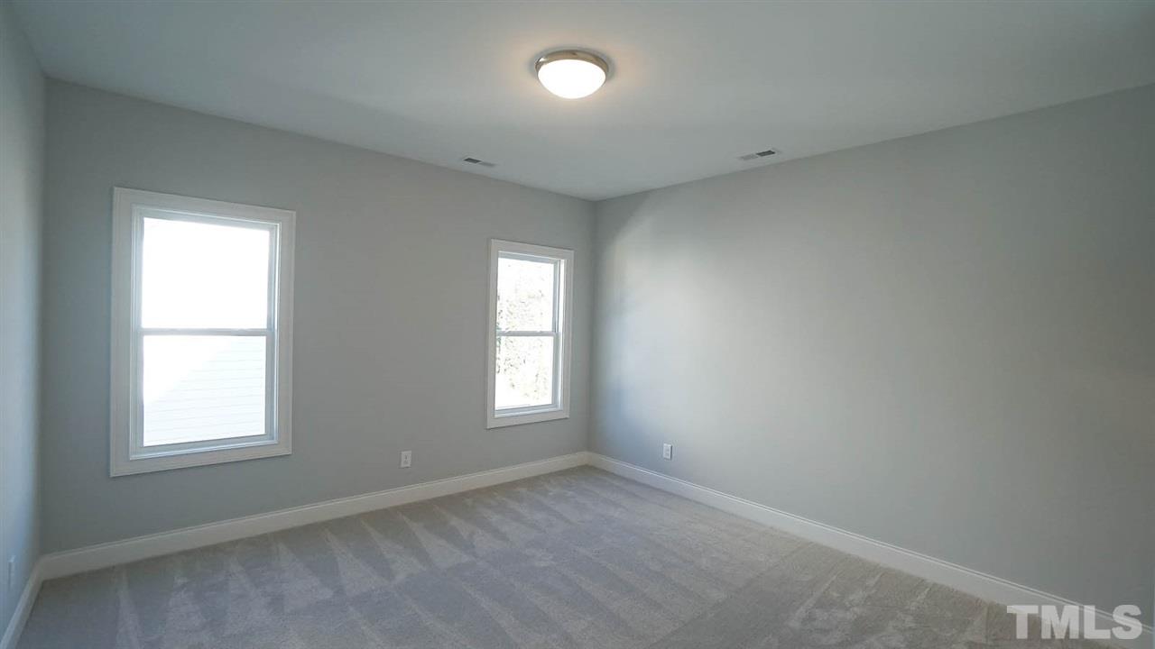 4400 Duraleigh Road Raleigh, NC 27612 - Photo 22 of 30 an empty room with a window