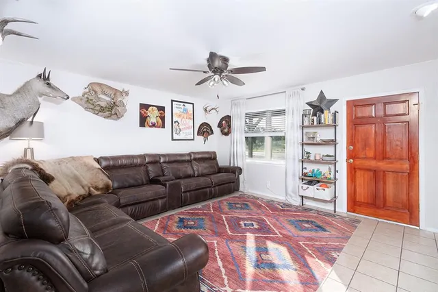 a living room with furniture and a window