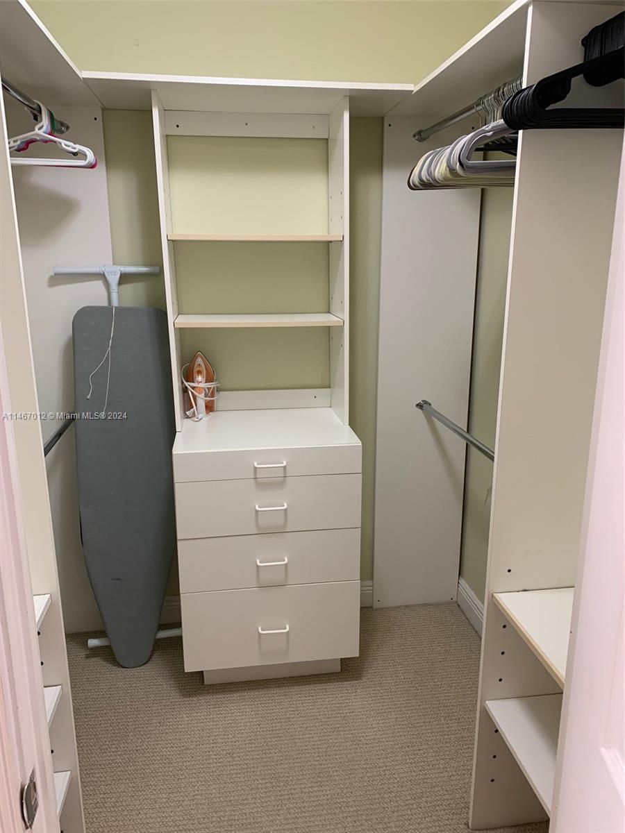 6039 Collins Avenue, Unit 1630 Miami Beach, FL 33140 - Photo 14 of 37 a room with storage and utility