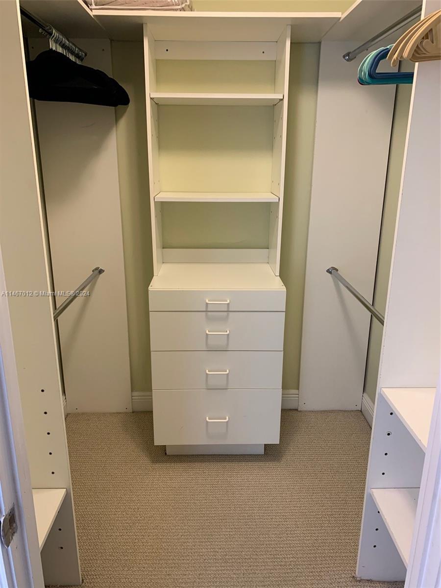 6039 Collins Avenue, Unit 1630 Miami Beach, FL 33140 - Photo 15 of 37 a utility room with dryer and washer