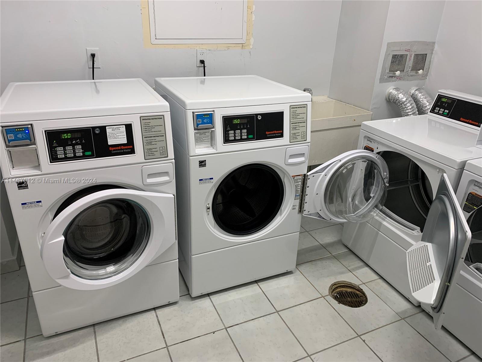 6039 Collins Avenue, Unit 1630 Miami Beach, FL 33140 - Photo 26 of 37 a utility room with dryer and washer