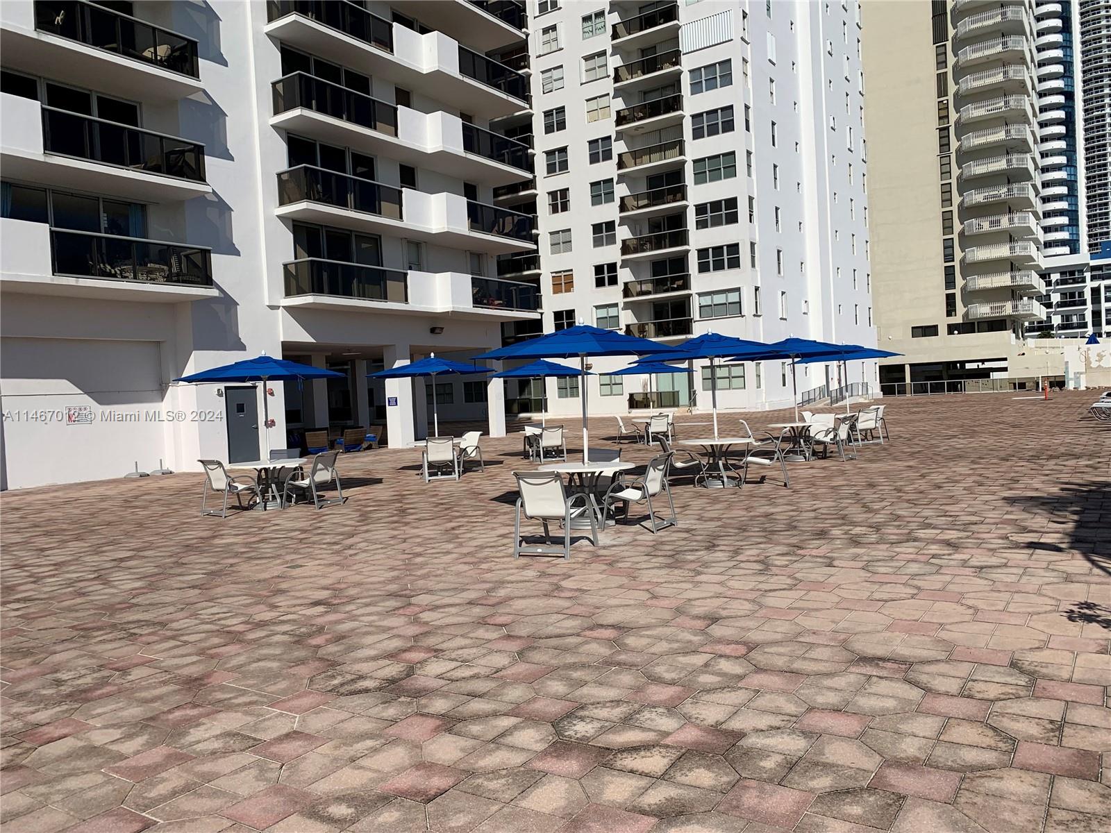 6039 Collins Avenue, Unit 1630 Miami Beach, FL 33140 - Photo 33 of 37 a view of a building with sitting area