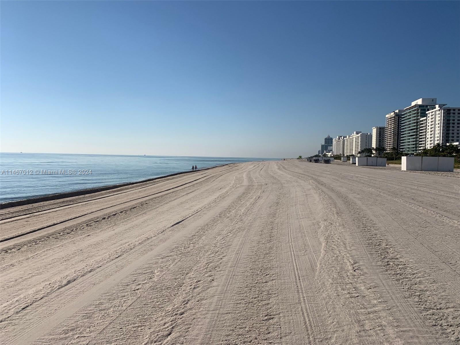6039 Collins Avenue, Unit 1630 Miami Beach, FL 33140 - Photo 36 of 37 a view of empty room with wooden floor