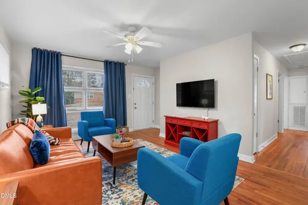 a dining room with furniture and window