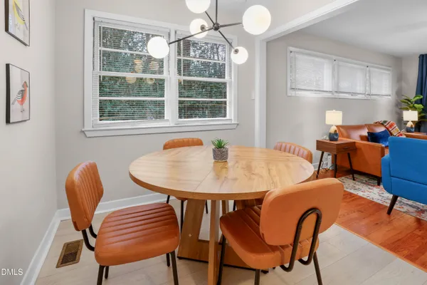 a kitchen with cabinets appliances a sink and a window