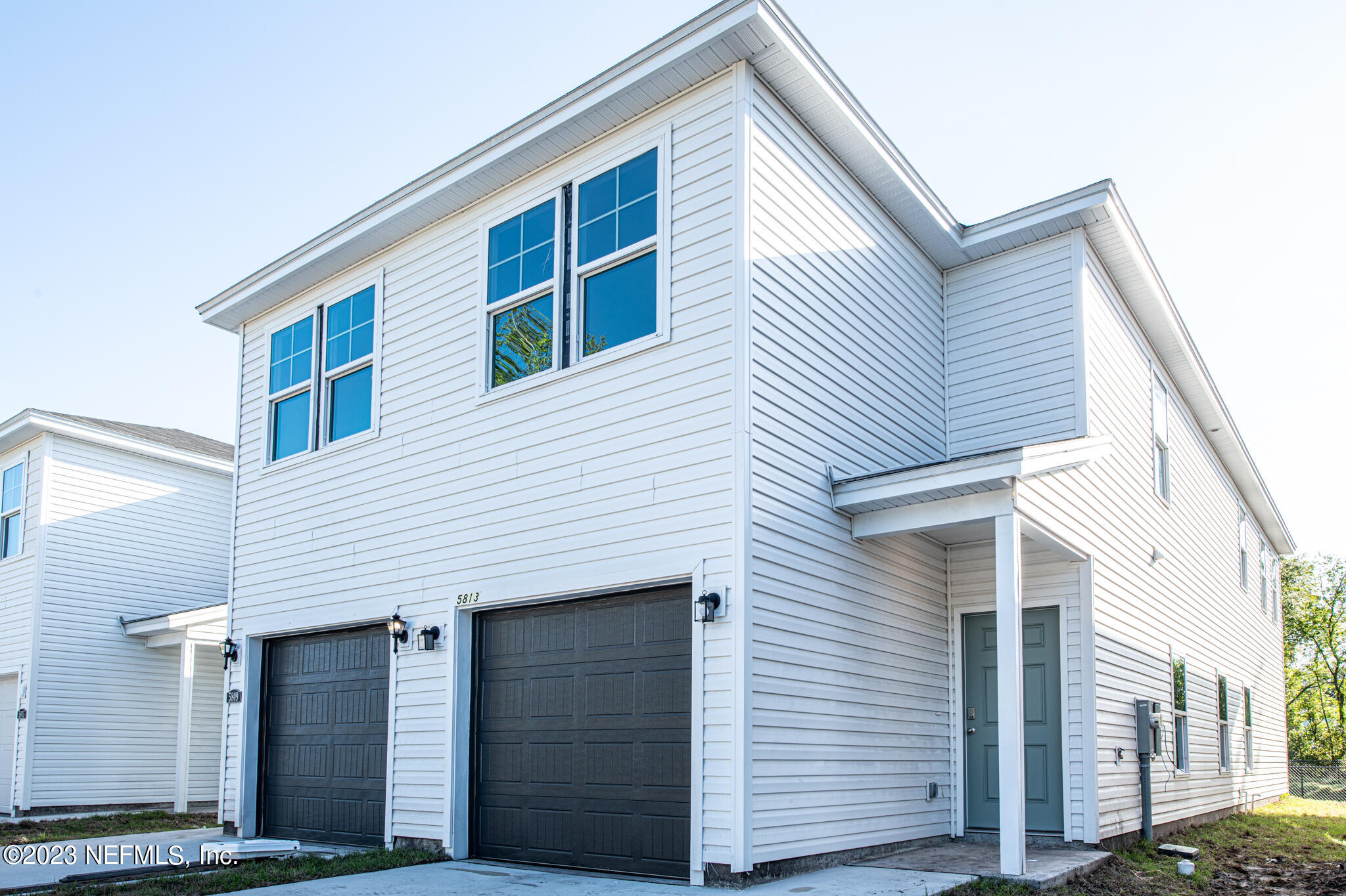 a front view of a house with a garage