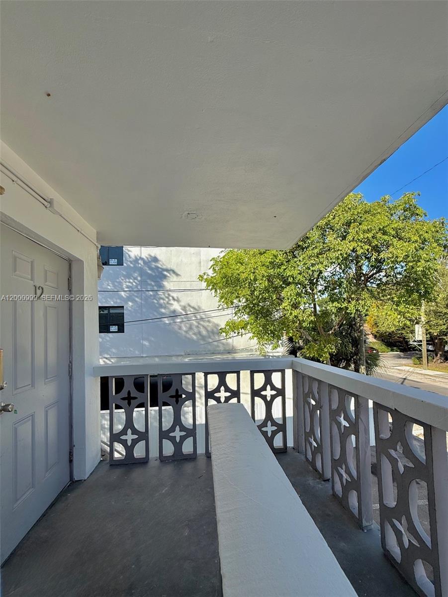 10 Northwest 77th Street, Unit 8 Miami, FL 33150 - Photo 6 of 15 a view of a balcony with furniture