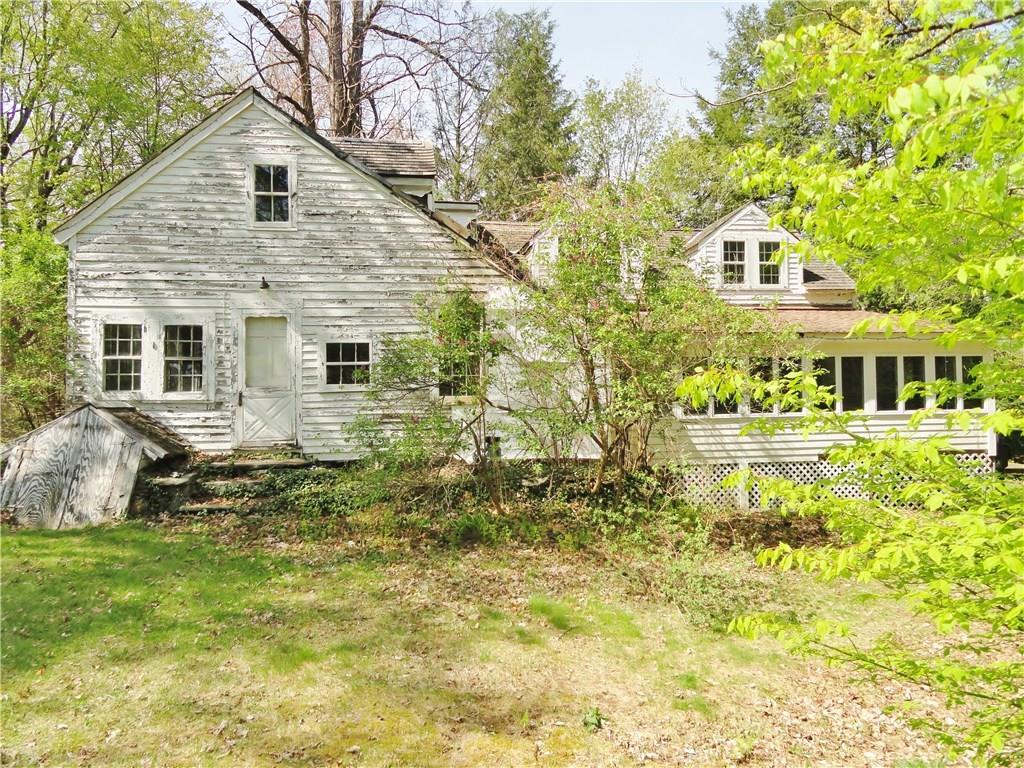 53 Moosehorn Road Litchfield, CT 06778 - Photo 1 of 1 a front view of a house with a yard