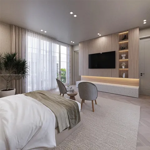 a spacious bedroom with a bed and a chair