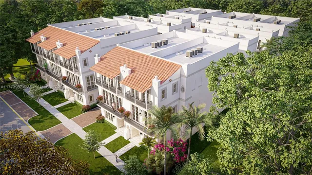 an aerial view of a house with yard and swimming pool