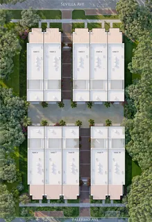 a aerial view of a multi story building with yard and large trees