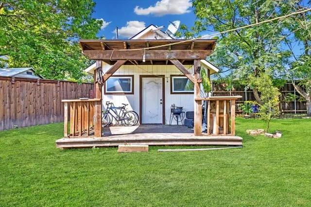 a view of a house with a yard porch and sitting area
