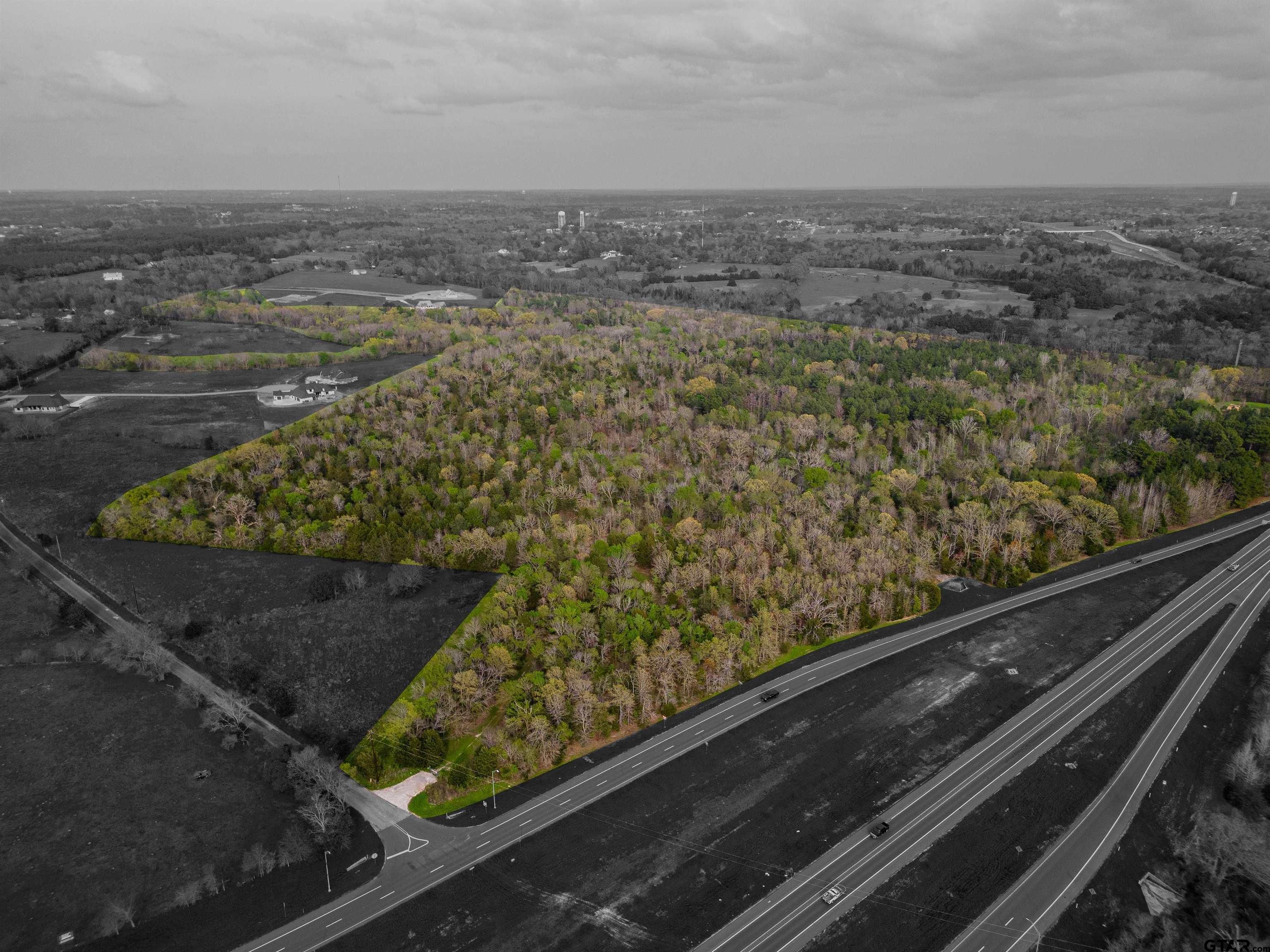 192 County Road 192 Tyler, TX 75703 - Photo 2 of 22 a view of a floor to ceiling window and a wooden floor
