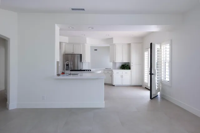 a view of kitchen with sink and cabinet