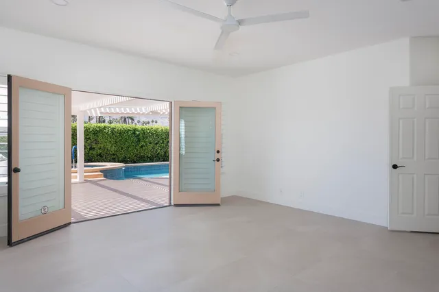 a view of an empty room with a sliding door