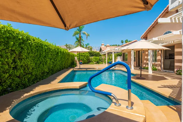 a view of a swimming pool with a patio