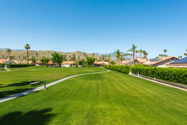 a view of a playground and basketball court