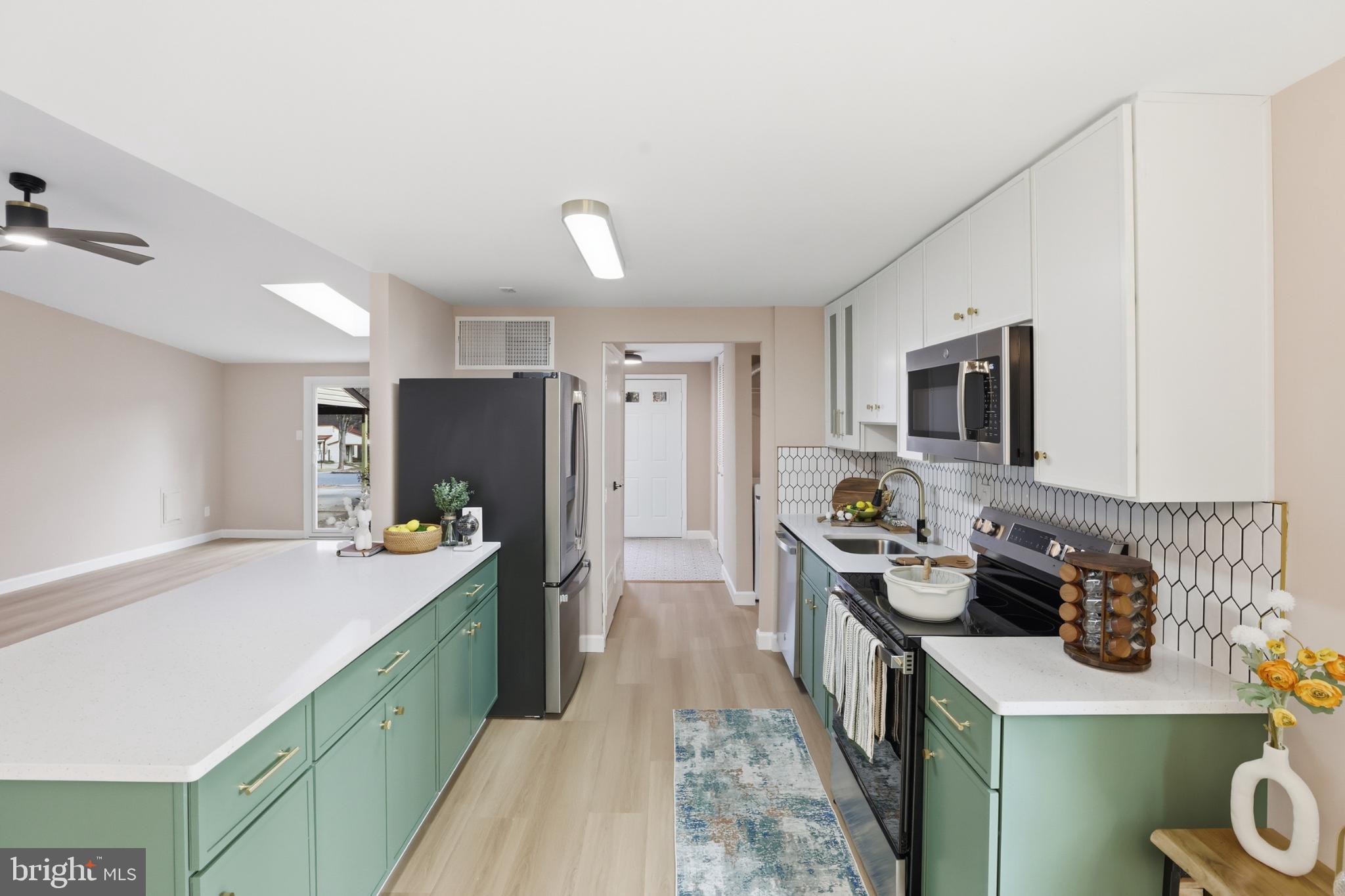 9029 Flicker Place Columbia, MD 21045 - Photo 14 of 31 Modern kitchen with stylish green accents.