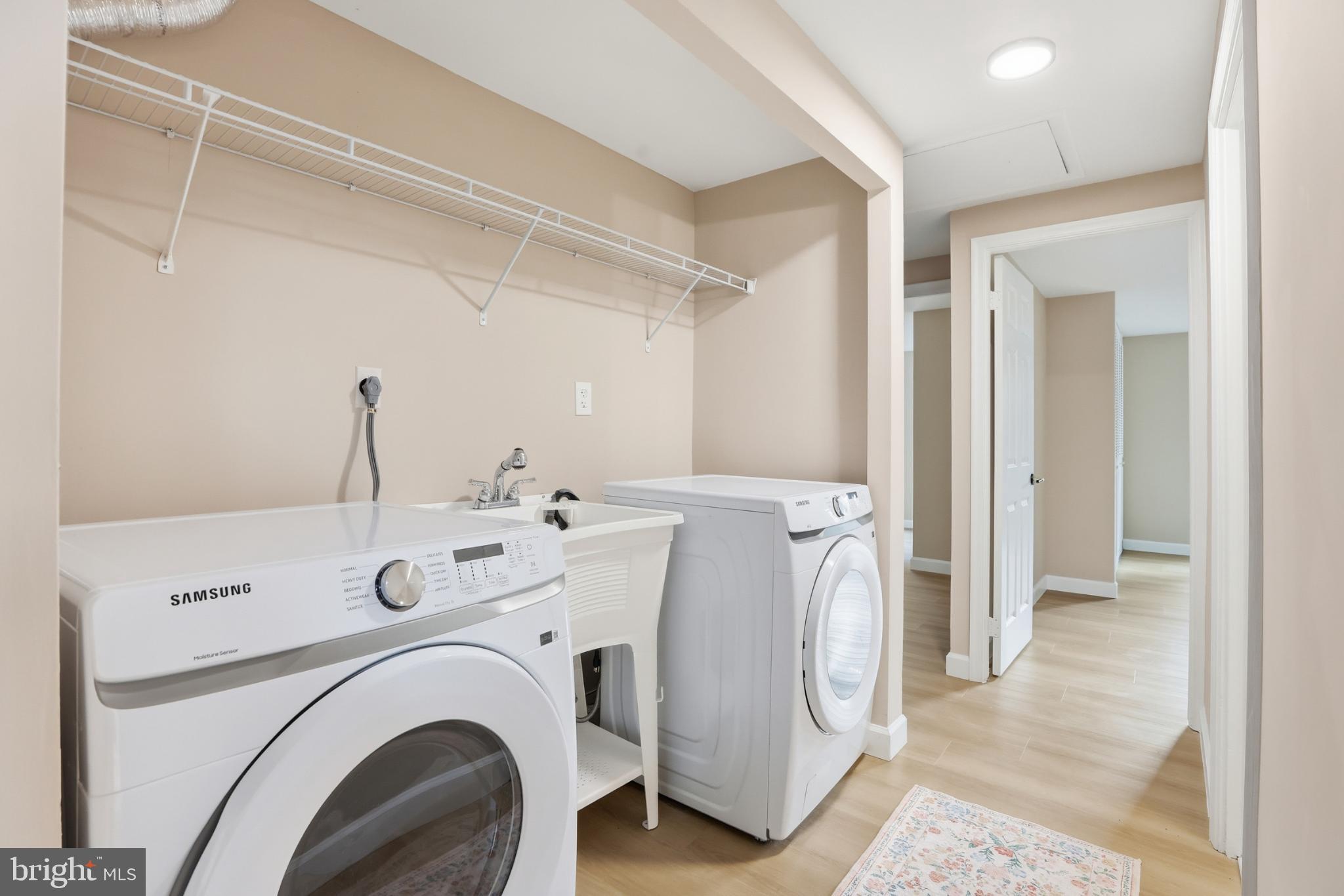 9029 Flicker Place Columbia, MD 21045 - Photo 16 of 31 Bright and functional laundry space w/ sink.