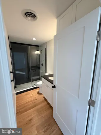 a bathroom with a shower and a tub